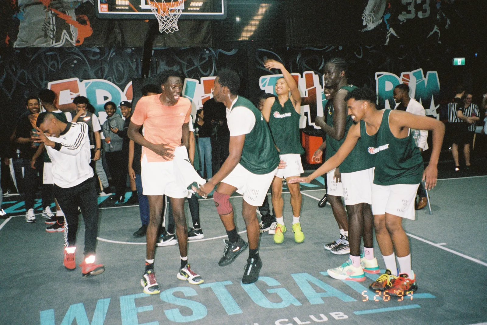 Players celebrating on court at the first Shooters Shoot in 2021