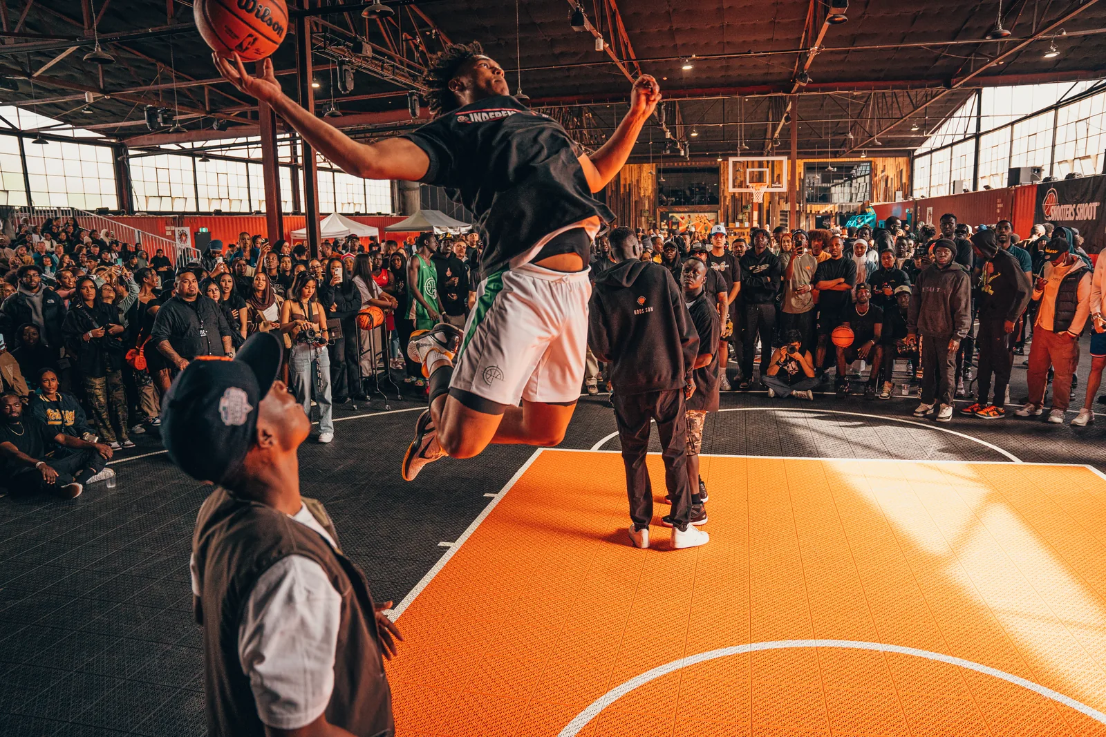A dunk in front of a packed crowd in 2022