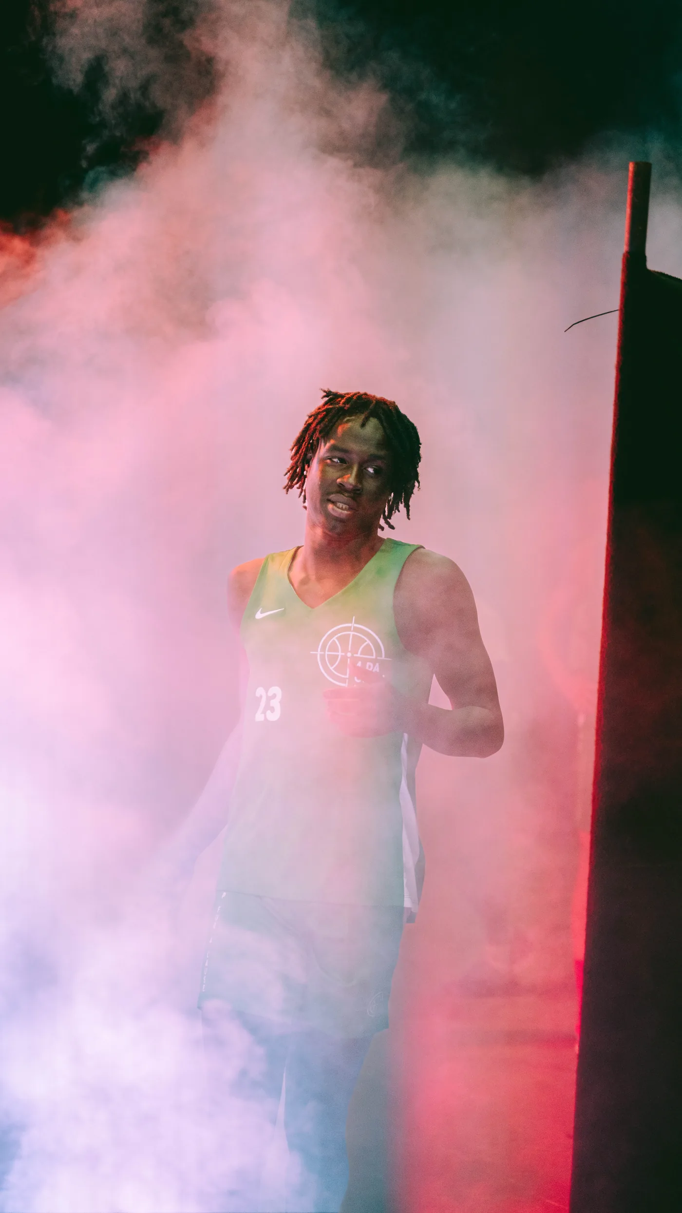 A player walks out through smoke